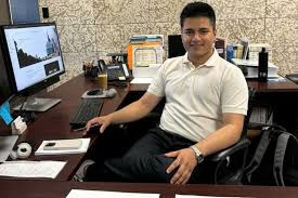 Picture of a student sitting at a desk
